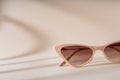 Fashionable beige cat eye frame sunglasses. Women\'s Trendy sunglasses still life in minimal stile. Fashionabl