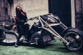 Fashionable biker girl posing on a new trike