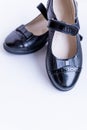 Fashionable black stylish girl`s leather loafers on white background. Fashionable school shoes.Elegant kid`s shoes Royalty Free Stock Photo