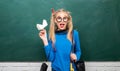 Fashionable blonde girl chalkboard background. Back to school. Stylish school pupil modern girl. Cute female funky style