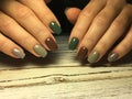 Fashionable brown manicure on short nails with gray and green