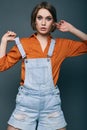 Fashionable brunette beautiful woman posing in studio Royalty Free Stock Photo