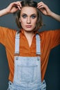 Fashionable brunette beautiful woman posing in studio Royalty Free Stock Photo