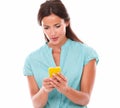 Fashionable brunette lady sending text message Royalty Free Stock Photo