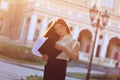 Fashionable business lady looks at paper forms. Portrait of a young brunette