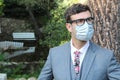 Fashionable businessman wearing breathing mask