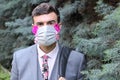 Fashionable businessman wearing flamboyant breathing mask