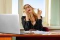 Fashionable busty secretary talking phone in office