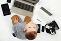 Fashionable child with computers, tablets, phones, gadgets around Royalty Free Stock Photo