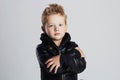 Fashionable child in leather coat.little boy hairstyle