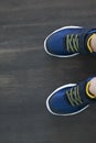 fashionable children shoes on wooden floor, view from top, selfie Royalty Free Stock Photo