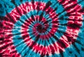 Red, Blue and Black Retro Abstract Psychedelic Tie Dye Swirl Design on cotton shirt. Royalty Free Stock Photo