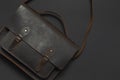 Fashionable concept. Brown leather men`s bag on black background top view flat lay with copy space. Briefcase for work, Royalty Free Stock Photo