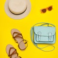 Fashionable concept. Women`s beach hat, handbag, brown shoes. Ye Royalty Free Stock Photo