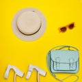 Fashionable concept. Women`s beach hat, handbag, white shoes. Ye Royalty Free Stock Photo