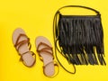 Fashionable concept. Women`s handbag and sandals. Yellow backgr Royalty Free Stock Photo