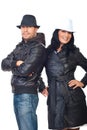 Fashionable couple in leather coats and hats