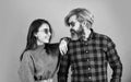 Fashionable couple posing. Enjoying spring time together. Street style. Today is a good day. Hipster couple. Bearded man Royalty Free Stock Photo