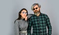 Fashionable couple posing. Street style. Today is a good day. Hipster couple. Bearded man with dyed hair and stylish Royalty Free Stock Photo