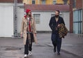 MILAN - FEBRUARY 22, 2018: Fashionable couple street style outfit