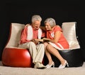 Fashionable elderly couple in studio
