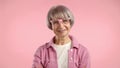 Fashionable elderly lady in pink, exuding confidence and charm. Camera 8K