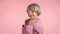 Fashionable elderly lady in pink, exuding confidence and charm. Camera 8K