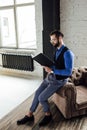 fashionable elegant businessman reading notebook in loft Royalty Free Stock Photo