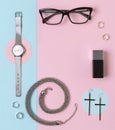 Fashionable female accessories watch, glasses, earrings, perfume, rings and necklace with copy space