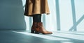Stylish Brown Leather Ankle Boots Paired with Black Tights in Sunlit Room