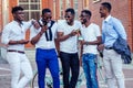 Fashionable friends at a meeting. a group of five handsome African American men well-dressed businessmen having fun and