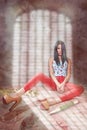 Fashionable girl in bright clothes siting. Shadow of the lattice. vampire style Royalty Free Stock Photo