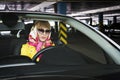 Fashionable girl driver looks at the camera.. one glamorous brutal blonde woman sit in cabriolet car, glamour girl inside cabrio