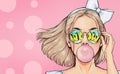 Fashionable girl with a stylish haircut inflates a chewing gum has amazed expression. Pop Art wow woman in glasses Royalty Free Stock Photo