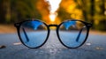 Fashionable glasses elegantly exhibited on the pavement of a vibrant urban street