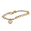 Fashionable golden bracelet with heart shape pendant Royalty Free Stock Photo