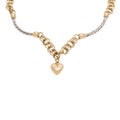 Fashionable golden necklace with heart shape pendant Royalty Free Stock Photo