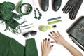 Fashionable green manicure on long nails and stylish accessories