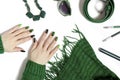 Fashionable green manicure on long nails and stylish accessories