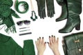 Fashionable green manicure on long nails and stylish accessories