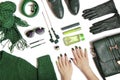 Fashionable green manicure on long nails and stylish accessories