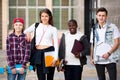 Group of teens posing outside school Royalty Free Stock Photo