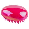 Fashionable hair brush - metallic pink color, isolated on white Royalty Free Stock Photo
