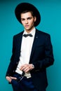 Fashionable Handsome Man in hat wearing elegant suit. Royalty Free Stock Photo