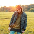 Fashionable handsome man in a military jacket with a hat Royalty Free Stock Photo