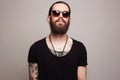 Fashionable handsome man with tattoo and sunglasses Royalty Free Stock Photo