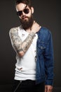 Fashionable handsome man with tattoo and sunglasses Royalty Free Stock Photo