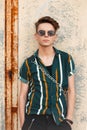Fashionable handsome young guy in stylish sunglasses Royalty Free Stock Photo