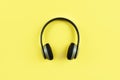 Headphones on yellow background.