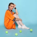 Trendy woman posing with tennis balls Royalty Free Stock Photo